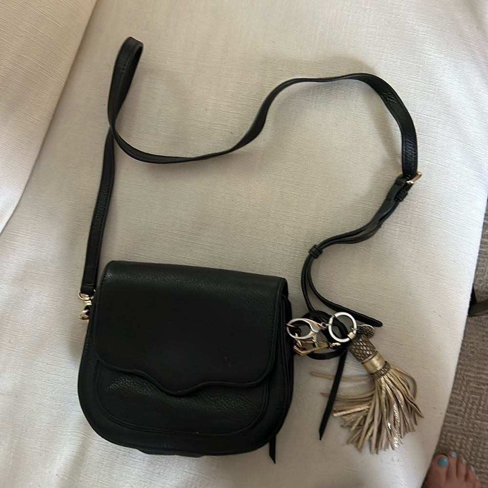 Rebecca Minkoff's sleek mini crossbody saddle shape.  Like new